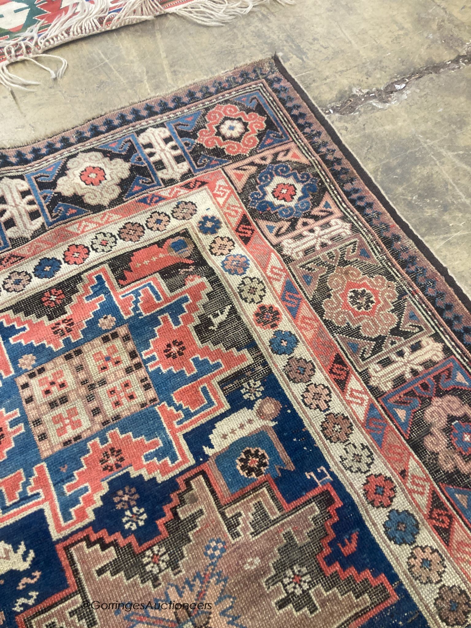 A Caucasian blue ground rug, 155 x 100cm